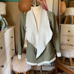 Unity World Wear green jacket